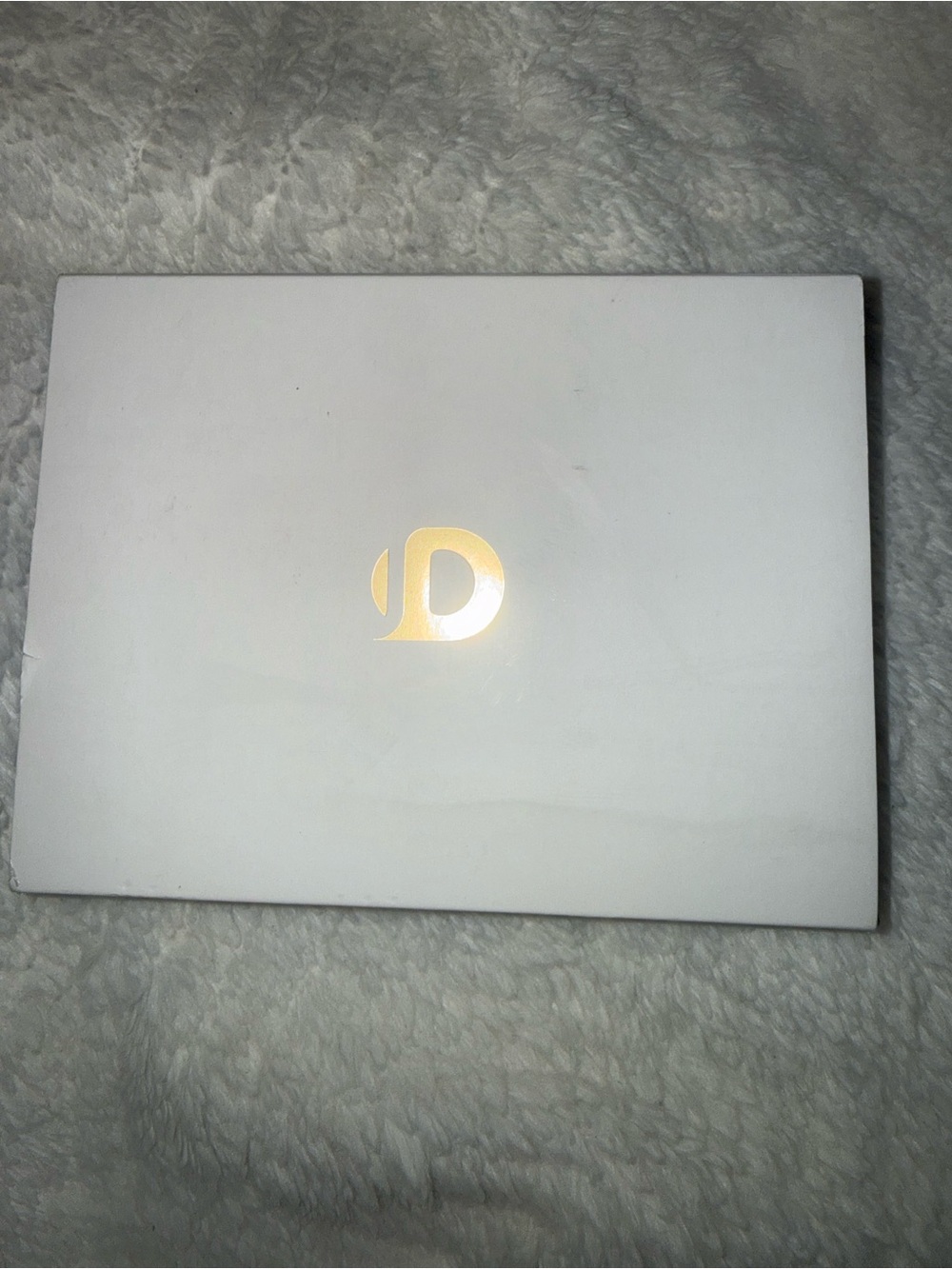 White Laptop with Gold Accent - Sleek Portable Notebook